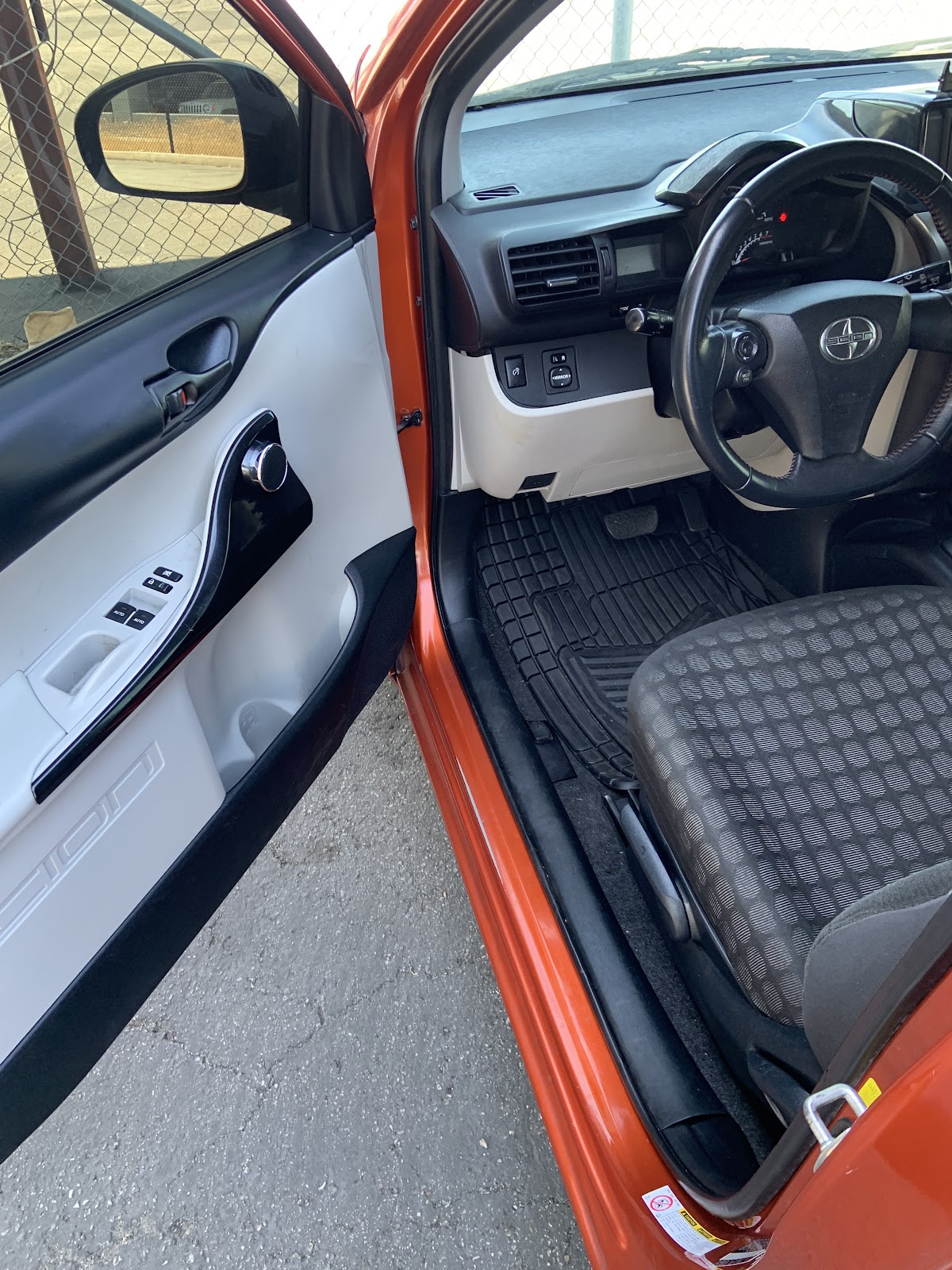 Open driver door showing cleaned Toyota interior