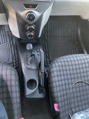 Toyota seats, floor mats, and center console after a full interior cleaning